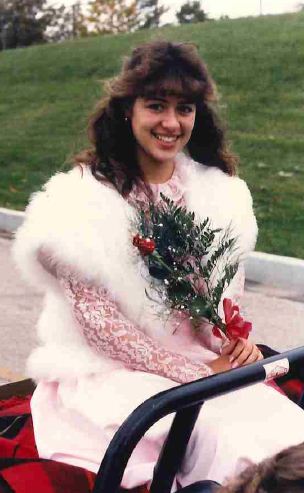 Mrs. Kane rode in a separate vehicle during the homecoming parade in 1986 because she was a member of Homecoming Court.